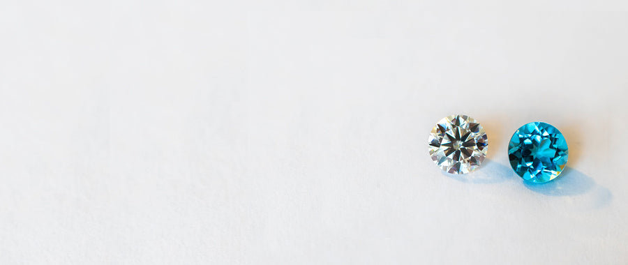 Two lab-grown diamonds, one white and one blue.